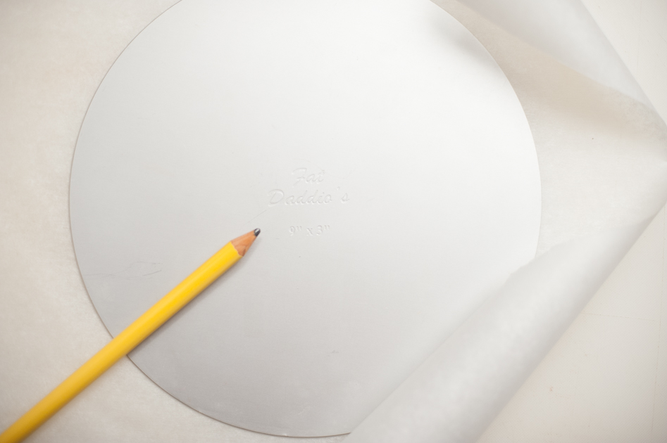 lay the pan bottom on parchment paper and cut out the circle