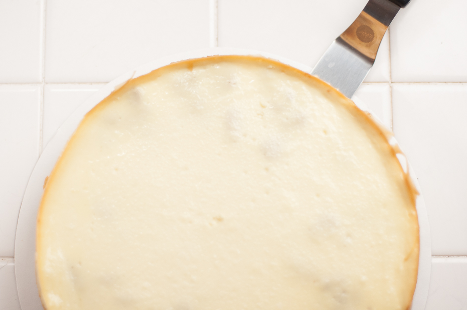 slide offset spatula between paper and pecan pie cheesecake crust