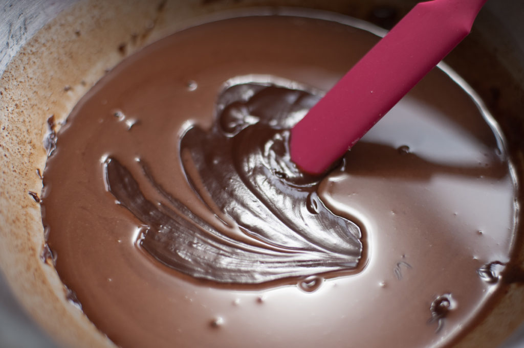 gently heat and stir the chocolate chips, cream and espresso powder with thin teflon spatula