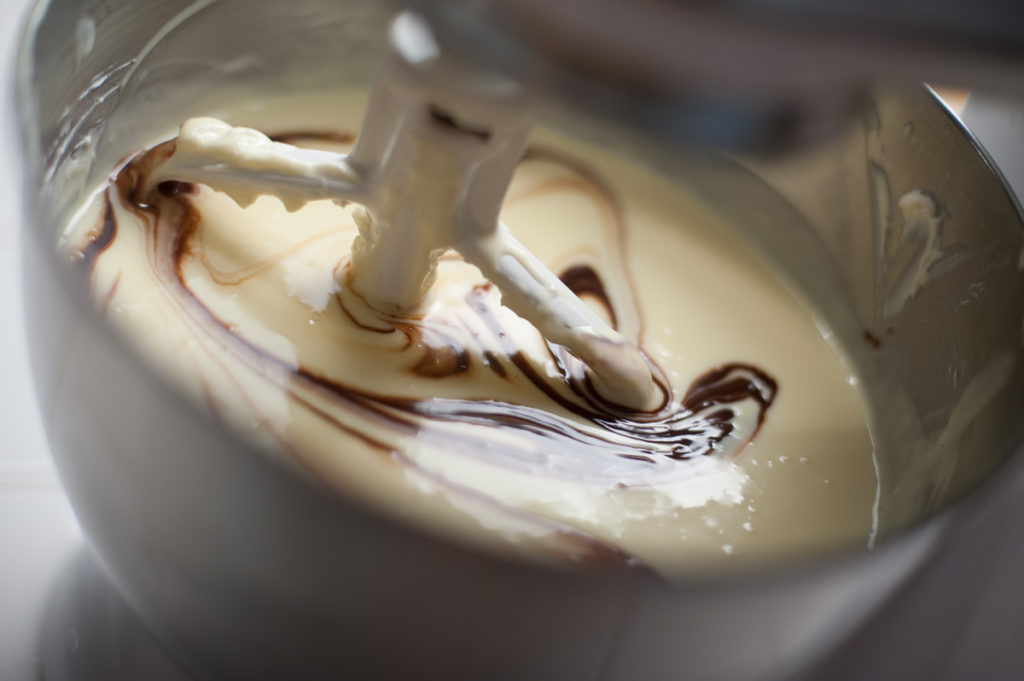 incorporate the chocolate ganache on slow mixer speed until there are no streaks
