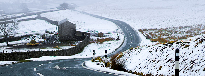 SHOWS FARM BUILDING IN WINTER